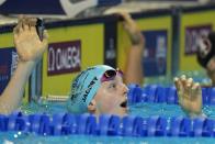 Lydia Jacoby reacts after winning her heat in the Women's 100 Breaststroke during wave 2 of the U.S. Olympic Swim Trials on Monday, June 14, 2021, in Omaha, Neb. (AP Photo/Jeff Roberson)