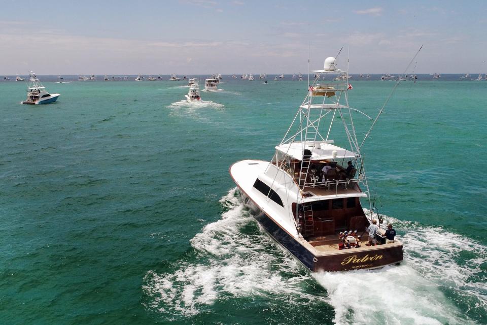 Fishing boats make their way out of Destin's East Pass at the start of the 2020 Emerald Coast Blue Marlin Classic.