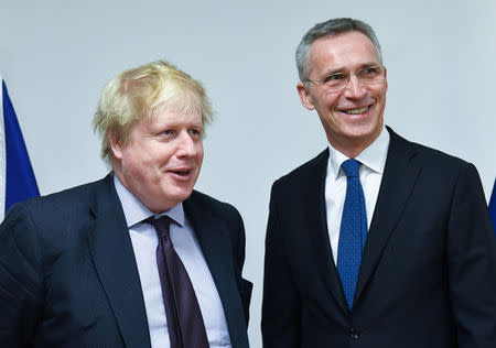 British Foreign Secretary Boris Johnson poses with NATO Secretary-General Jens Stoltenberg at the Alliance headquarters in Brussels, Belgium, March 19, 2018. Emmanuel Dunand/Pool via Reuters