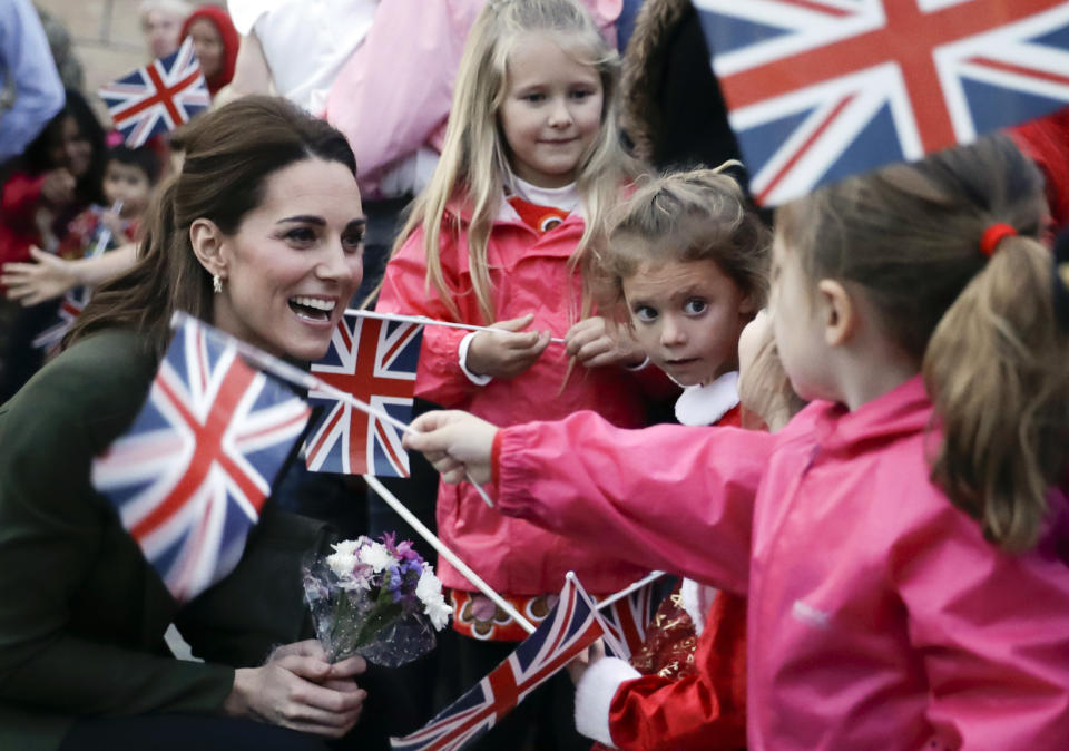 FILE - In this Wednesday, Dec. 5, 2018 file photo, Kate, the Duchess of Cambridge, greets family members of personnel at the Akrotiri Royal Air Force base, near the south coastal city of Limassol, Cyprus. Prince Philip was the longest serving royal consort in British history. In Britain, the husband or wife of the monarch is known as consort, a position that carries immense prestige but has no constitutional role. The wife of King George VI, who outlived him by 50 years, was loved as the Queen Mother. Prince Charles’ wife, Camilla, has worked to emerge from the shadow of his immensely popular first wife, Diana. (AP Photo/Matt Dunham, Pool, File)