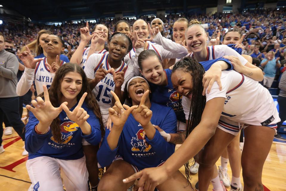 Kansas players huddle together after defeating Columbia 66-59 to win the 2023 Postseason WNIT championship April 1 inside Allen Fieldhouse.