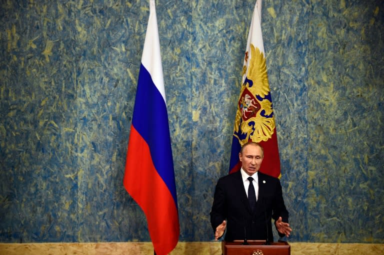 Russian President Vladimir Putin holds a press conference, on November 30, 2015, during of the COP21 United Nations conference on climate change in Le Bourget on the outskirts of the French capital Paris