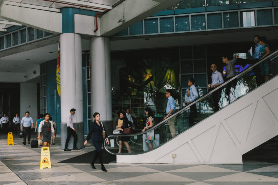 Singapore's Central Business District during lunch hour, illustrating a story on local workers' sentiments on working hours.