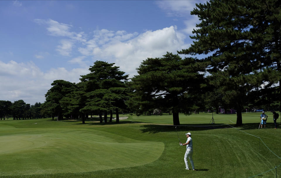 Japan's Rikuya Hoshino chips onto the 6th green during a practice round of the men's golf event at the 2020 Summer Olympics, Tuesday, July 27, 2021, at the Kasumigaseki Country Club in Kawagoe, Japan, (AP Photo/Matt York)