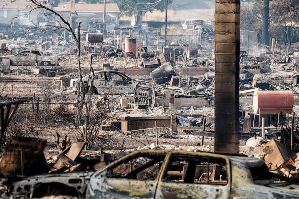 PHOTO: Homes and vehicles destroyed by the Mill Fire, Sept. 3, 2022, in Weed, Calif.  (Noah Berger/AP)