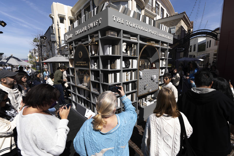 Taylor Swift fans check out a new pop-up opening to celebrate Taylor Swift's upcoming album "The Tortured Poets Department," at the Grove in Los Angeles on Wednesday, April 17, 2024. (AP Photo/Richard Vogel)