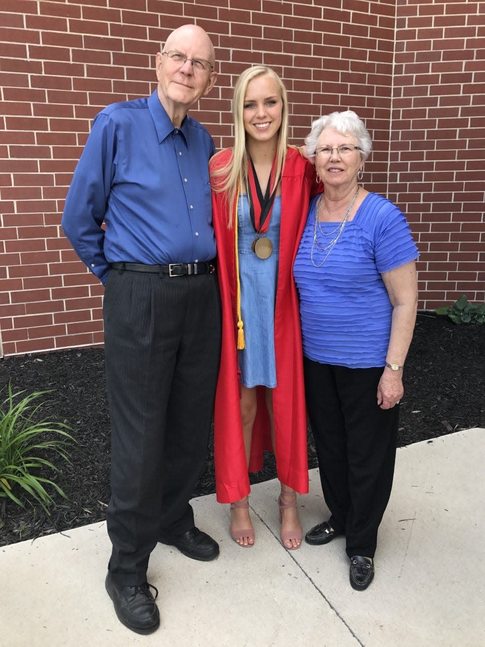 Richard and Marjorie Johnson attend the high school graduation of their granddaughter, Kacie Thompson.