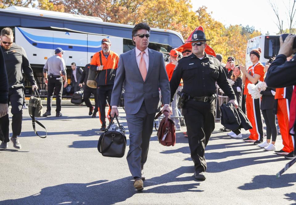 Nov 6, 2021; Morgantown, West Virginia, USA; Oklahoma State Cowboys head coach Mike Gundy walks into the stadium before their game against the West Virginia Mountaineers at Mountaineer Field at Milan Puskar Stadium. Mandatory Credit: Ben Queen-USA TODAY Sports