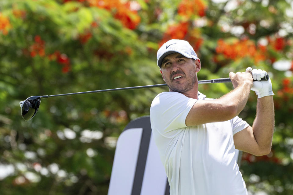 Captain Brooks Koepka of Smash GC hits his shot on the eigthteenth hole during the first round of LIV Golf Singapore at Sentosa Golf Club in Sentosa, Singapore, Friday, May 3, 2024. (Matthew Harris/LIV Golf via AP)
