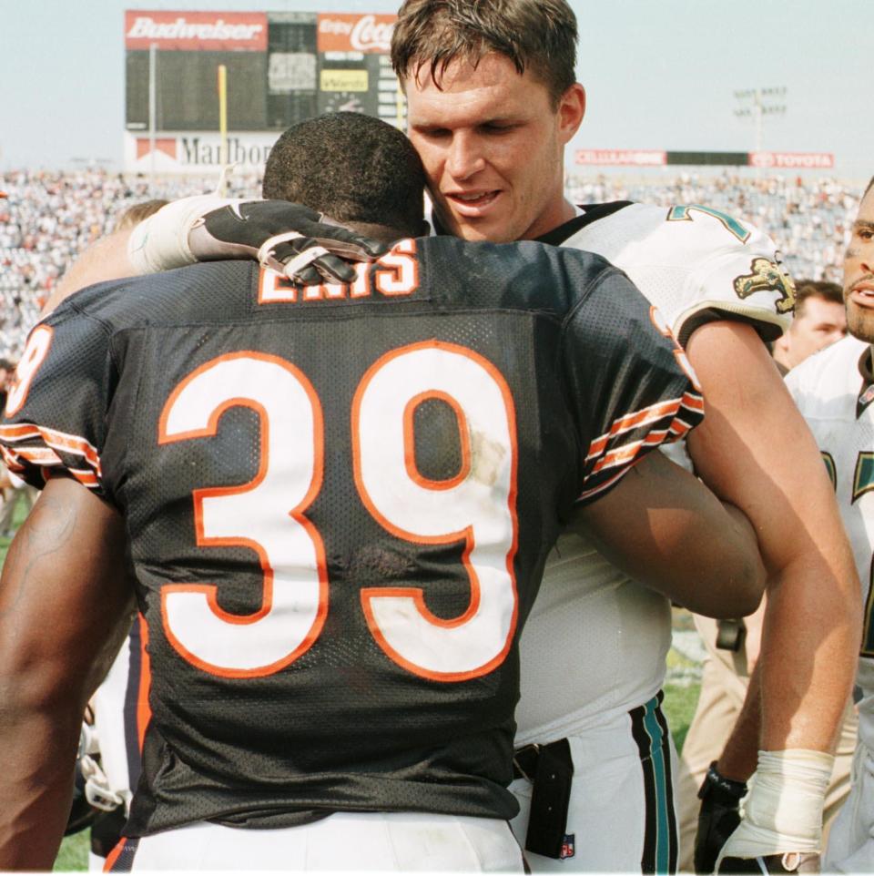 Sept. 6, 1998: Jaguar offensive tackle #71 Tony Boselli hugs Chicago Bears rookie running back ' Curtis Enis after the game at Soldiers Field.