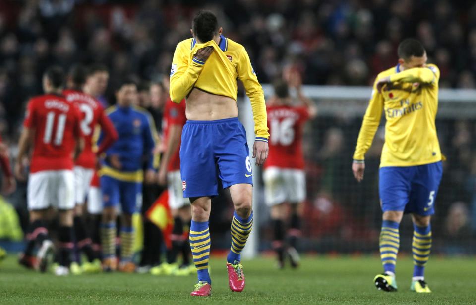 Arsenal's Laurent Koscielny reacts after their English Premier League soccer match against Manchester United at Old Trafford in Manchester, northern England, November 10, 2013.