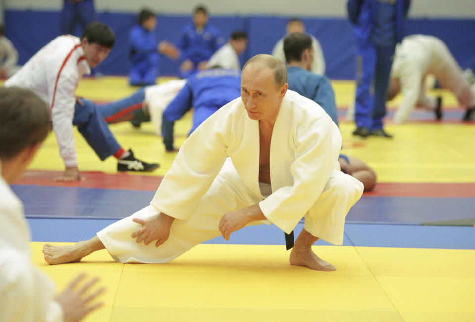 Putin takes part in a judo training session at the Moscow sports complex in St. Petersburg on Dec. 22, 2010.&nbsp;He was given tips on pushing his hips forward and how to use his left hand by his longtime judo coach during a sparring session.