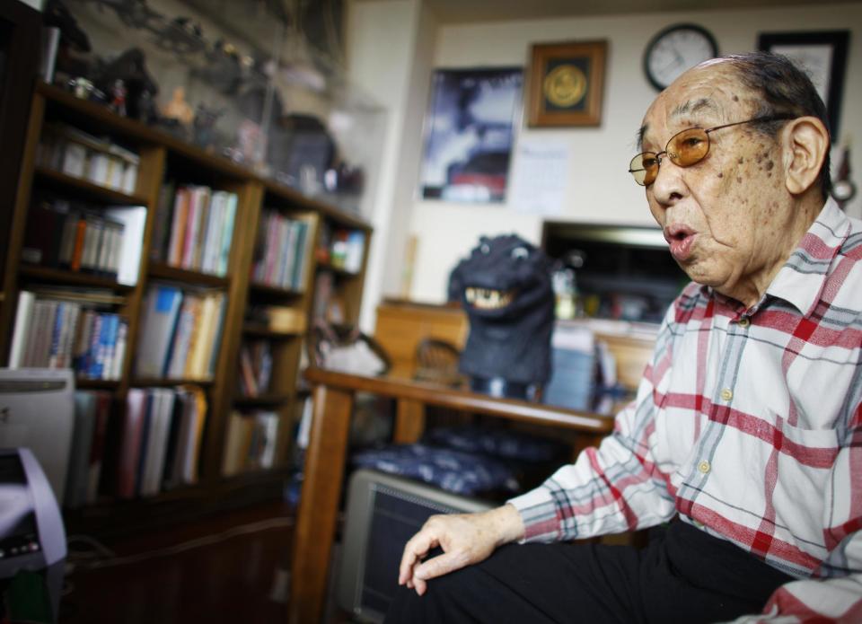 In this Monday, April 28, 2014 photo, original Godzilla suit actor Haruo Nakajima, who has played his role as the monster, speaks during an interview at his home in Sagamihara, near Tokyo. “I am the original, the real thing,” Nakajima, 85, said, stressing that later Godzilla are mere imitations. “If Godzilla can’t walk properly, it’s nothing but a freak show.” The theme of his Godzilla was grander and more complex, addressing universal human dilemma, as it spoke to a Japan that still remembered wartime suffering, he said. (AP Photo/Junji Kurokawa)