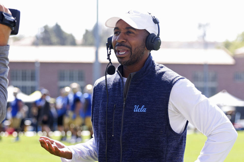 In this photo provided by UCLA Athletics, athletic director Martin Jarmond speaks during a spring showcase football event in Los Angeles, April 23, 2022. Jarmond was happy with the overall program's success last year, which included two national championships as well as success in football, men's and women's basketball. Jarmond's immediate goals though are concentrating on UCLA's move from the Pac-12 to the Big Ten Conference in 2024. (UCLA Athletics via AP)