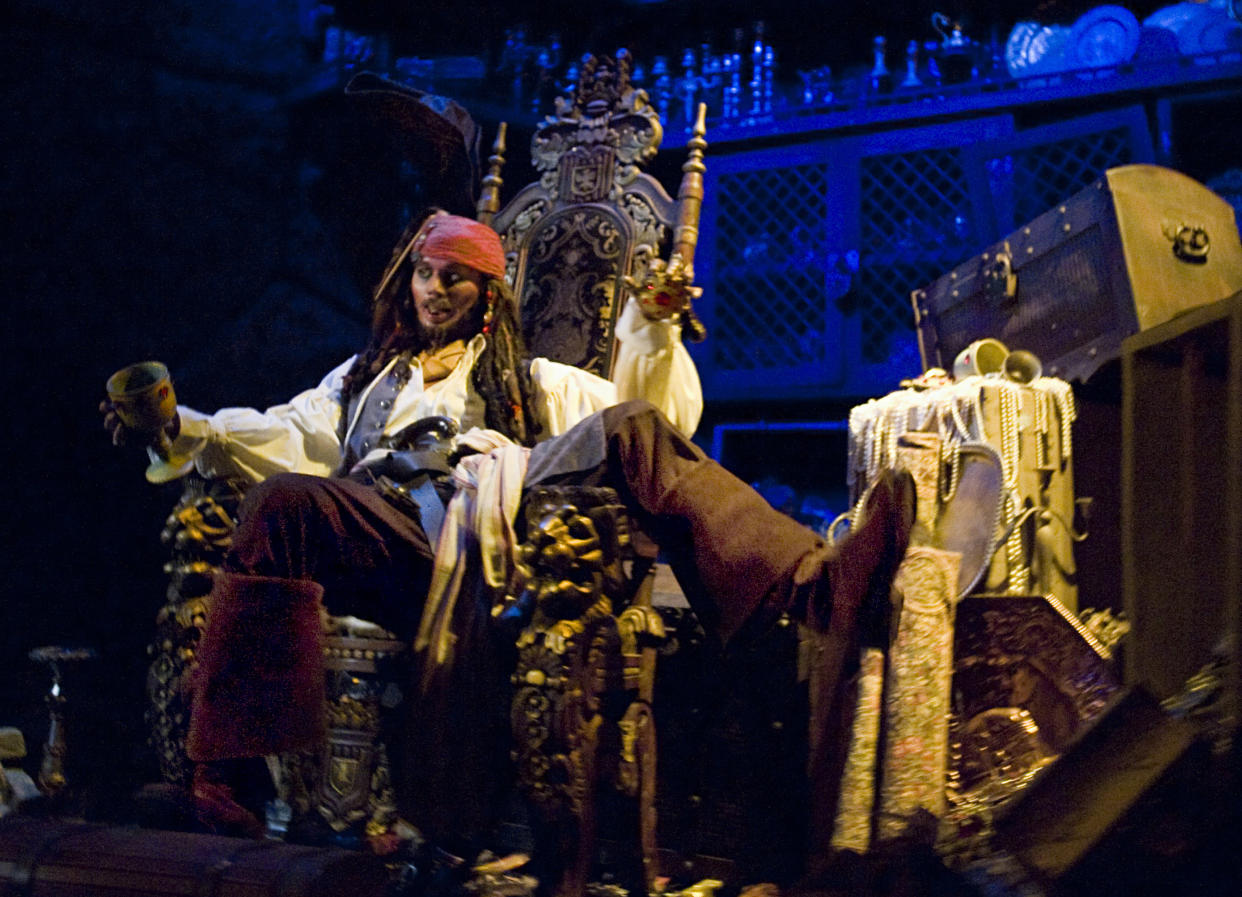 ANAHEIM, CA - MAY 16: A Jack Sparrow figure enjoys some stolen wares inside Pirates of the Caribbean ride at Disneyland in Anaheim, CA on May 16, 2011. Johnny Depp plays Sparrow in the movies based on the ride. The character, along with others from the movie, were added to the ride in 2006. (Photo by Joshua Sudock/Orange County Register via Getty Images)