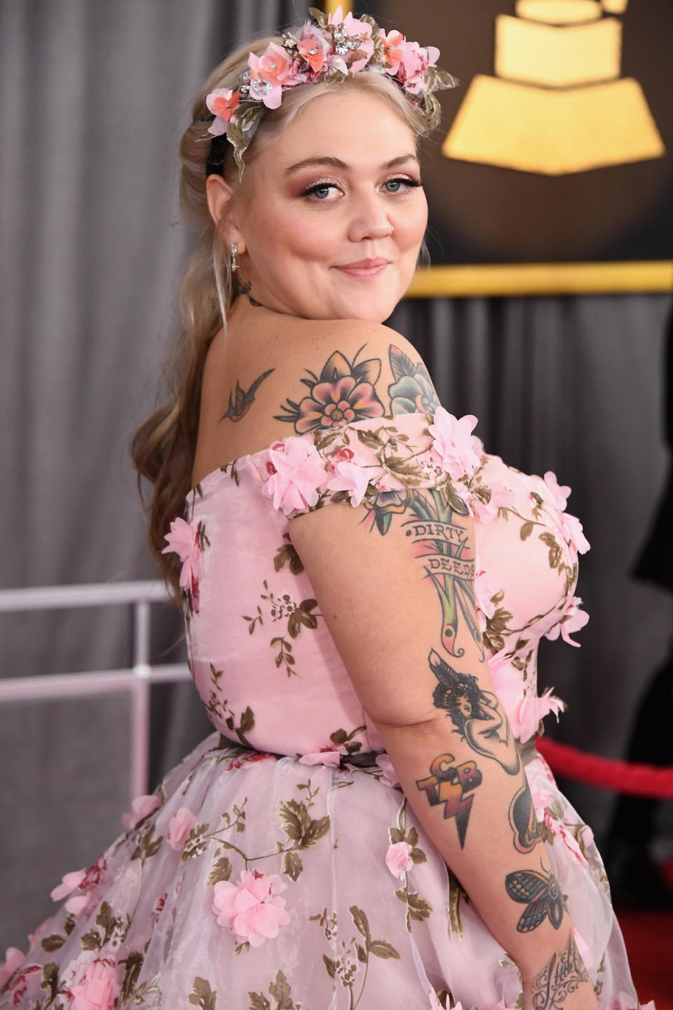 <p>The singer’s floral tattoos perfectly complemented her flower crown and ruffled dress. (Photo: Getty Images) </p>