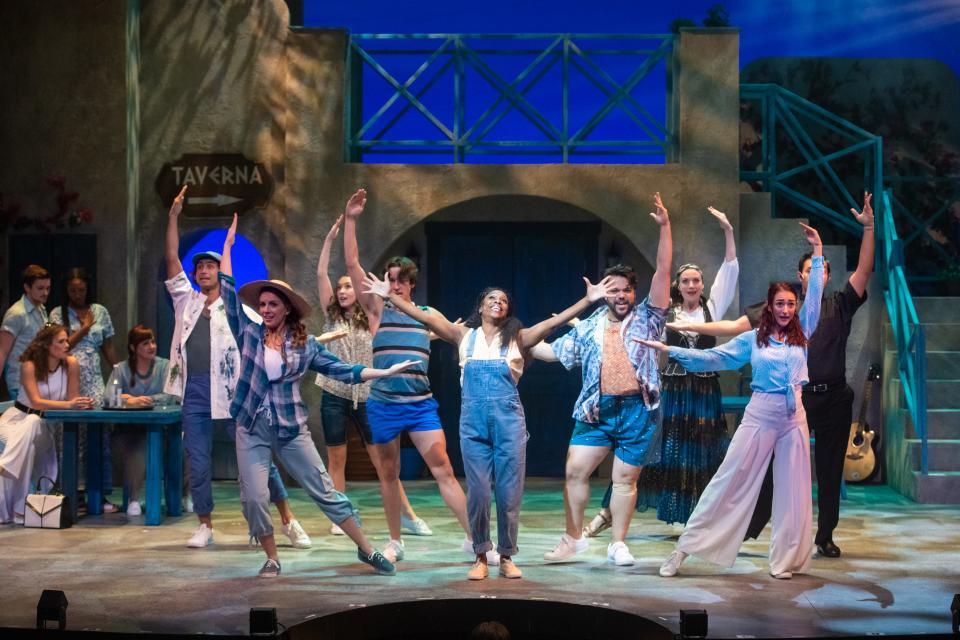 Lisa Estridge, center, and company perform in "Mamma Mia!," staged by Skylight Music Theatre.