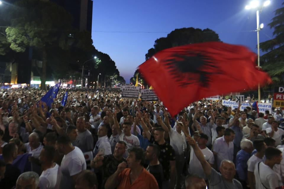 Antigovernment protesters take part in a rally in Tirana, Friday, June 21, 2019. The opposition is boycotting the local elections planned for June 30 and has threatened to disrupt them.(AP Photo/Hektor Pustina)