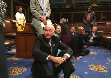 A photo shot and tweeted from the floor by U.S. House Rep. Rep. John Yarmuth shows Democratic members of the U.S. House of Representatives, including Rep. Joe Courtney (C) staging a sit-in on the House floor "to demand action on common sense gun legislation" on Capitol Hill in Washington, United States, June 22, 2016. REUTERS/ U.S. Rep.John Yarmuth/Handout