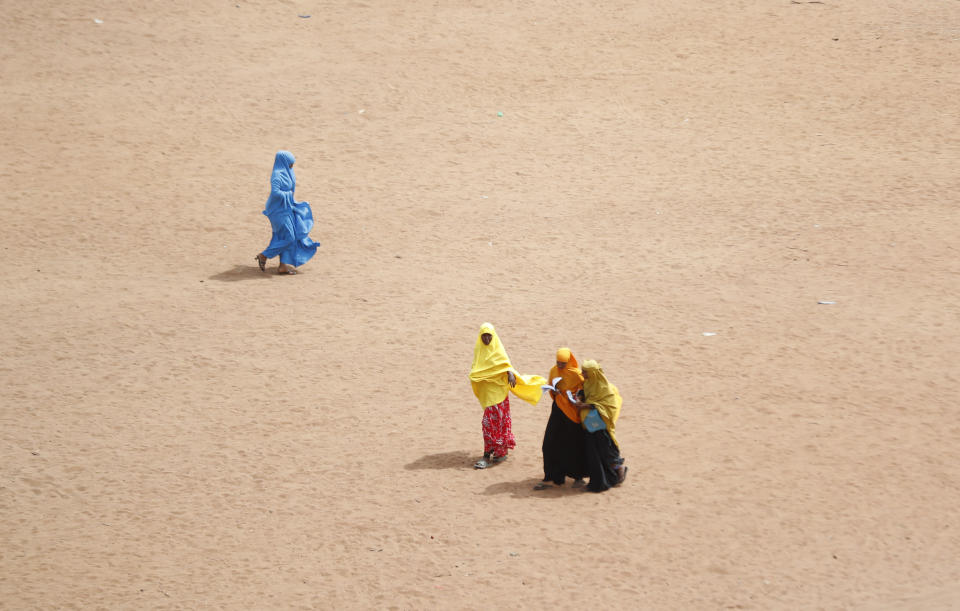 Somali refugee children walk home from school in Dadaab refugee camp in northern Kenya, Friday, July 14, 2023. One of the world's largest refugee camps offers a stark example of the global food security crisis with thousands of people fleeing Somalia in recent months to escape drought and extremism but finding little to eat when they arrive at the Dadaab camp in neighboring Kenya. (AP Photo/Brian Inganga)