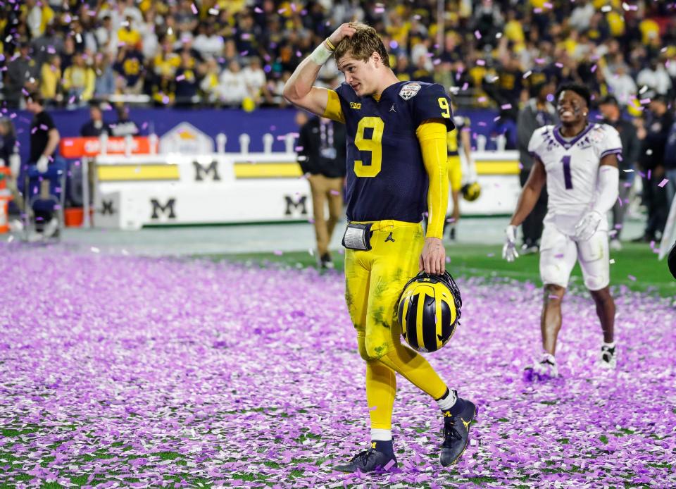 Michigan quarterback J.J. McCarthy (9) walks off the field after the Wolverines lost 51-45 to TCU at the Fiesta Bowl at State Farm Stadium in Glendale, Ariz. on Dec. 31, 2022.