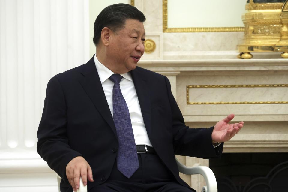 Chinese President Xi Jinping gestures while speaking to Russian President Vladimir Putin during their meeting at the Kremlin in Moscow, Russia, Monday, March 20, 2023. (Sergei Karpukhin, Sputnik, Kremlin Pool Photo via AP)