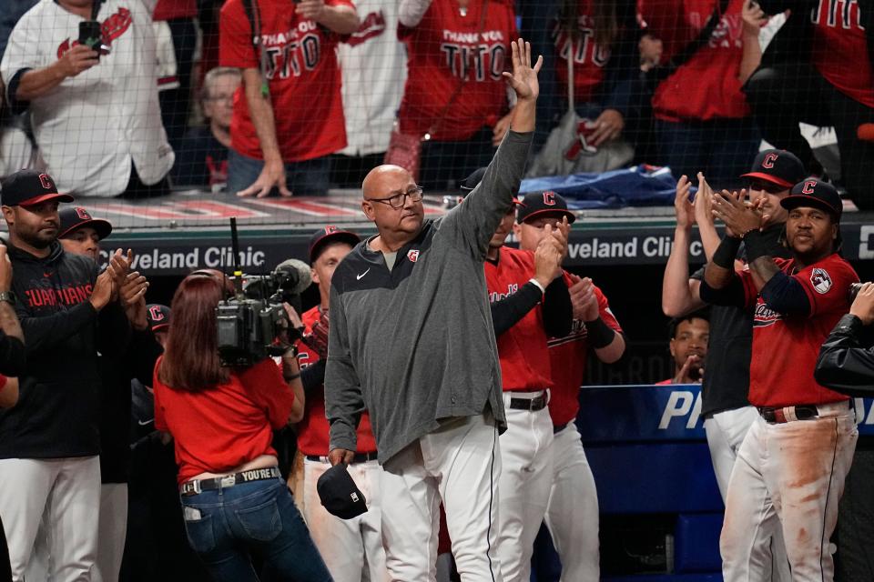 Guardians manager Terry Francona, center, waves his cap to fans after a win over the Cincinnati Reds, Wednesday, Sept. 27, 2023, in Cleveland.