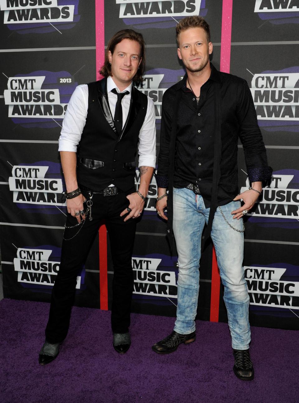 Tyler Hubbard, left, and Brian Kelley, of the group Florida Georgia Line, arrive at the 2013 CMT Music Awards at Bridgestone Arena on Wednesday, June 5, 2013, in Nashville, Tenn. (Photo by Frank Micelotta/Invision/AP)