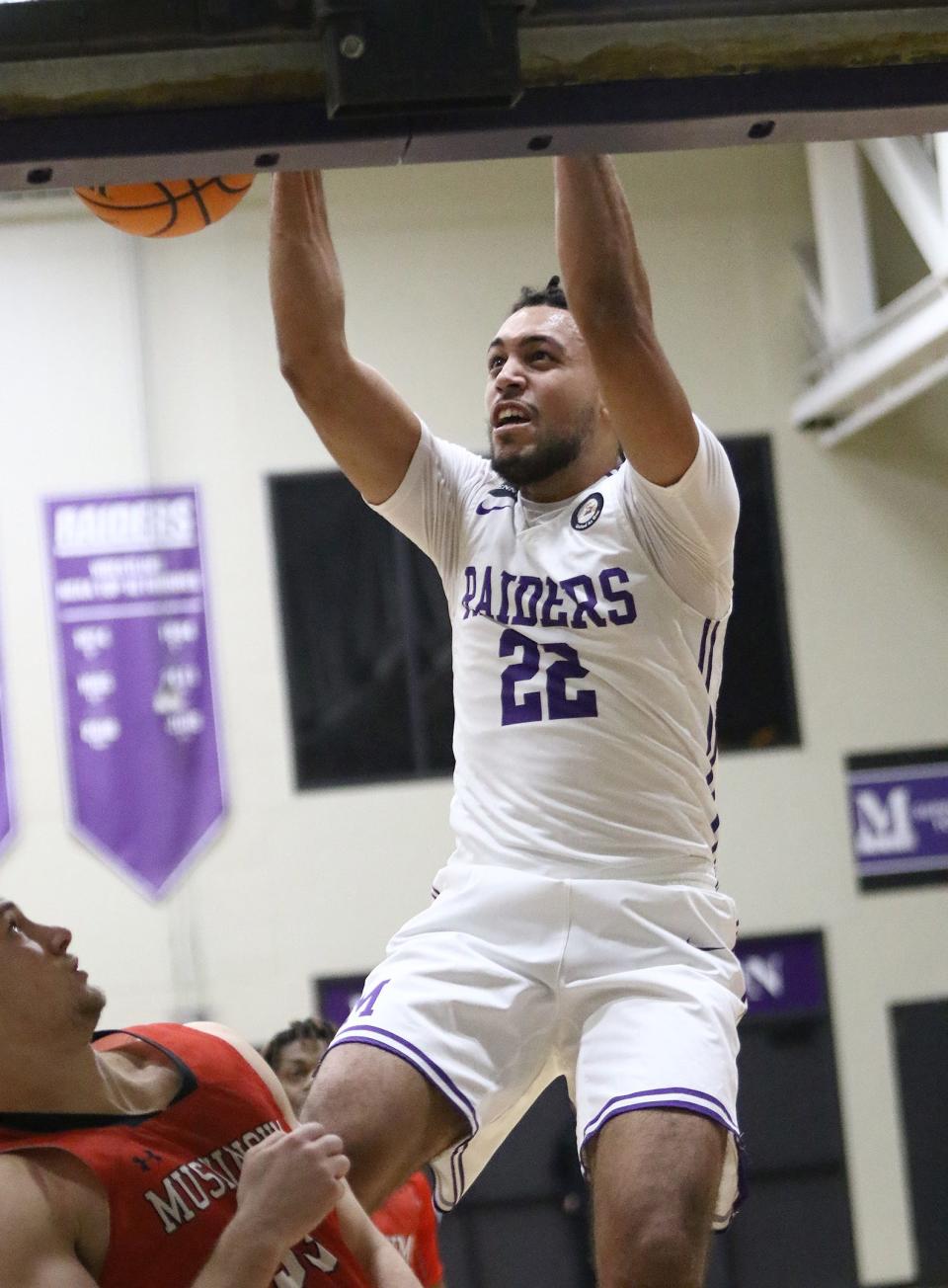 Mount Union's Christian Parker dunks vs. Muskingum, Wednesday, Feb. 15, 2023.