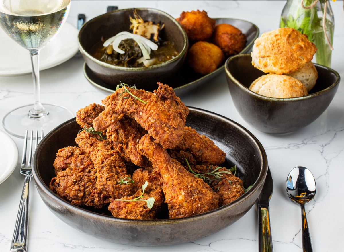 fried chicken dinner with a side of biscuits and wine.