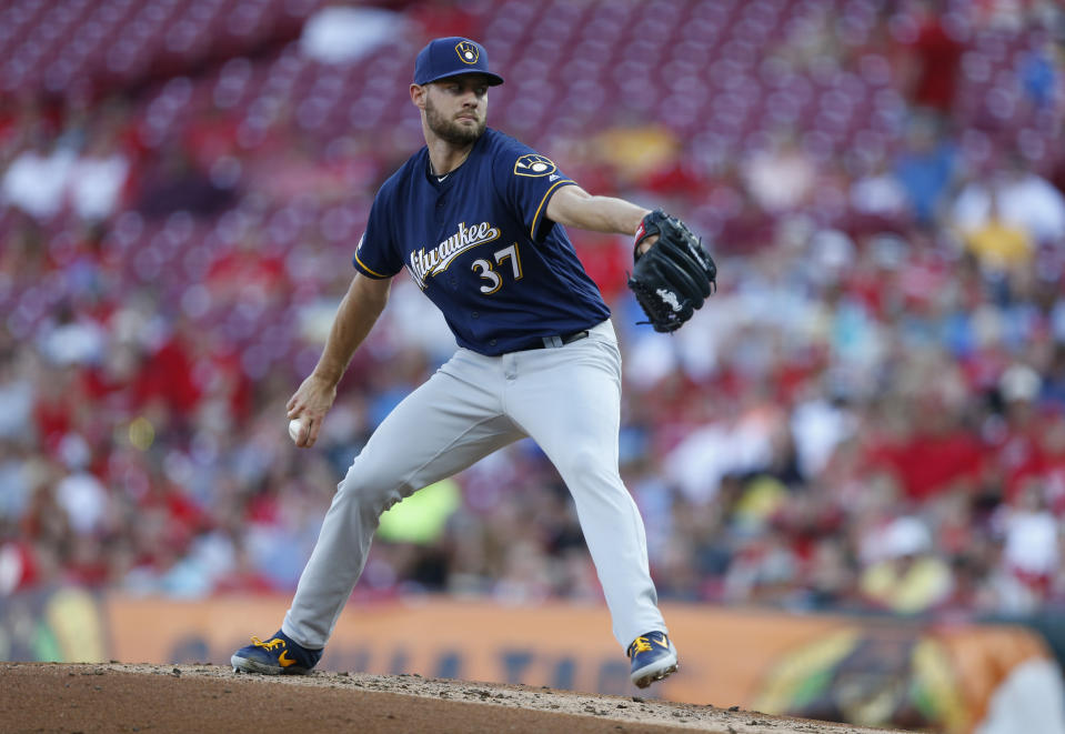 Milwaukee Brewers starting pitcher Adrian Houser (37) throws against the Cincinnati Reds during the first inning of a baseball game, Monday, July 1, 2019, in Cincinnati. (AP Photo/Gary Landers)