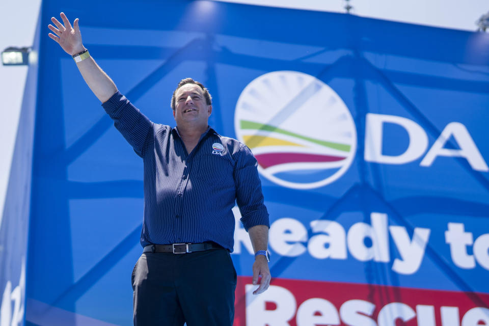 File - Opposition Democratic Alliance party leader John Steenhuisen waves to supporters in Pretoria, South Africa, on Feb. 17, 2024, at the party's manifesto launch in anticipation of the 2024 general elections. A campaign video for South Africa’s opposition party showing the country’s flag in flames has stoked tensions just weeks ahead of national elections that are seen as the most pivotal since the end of the apartheid system of racial segregation 30 years ago. (AP Photo/Jerome Delay, File)