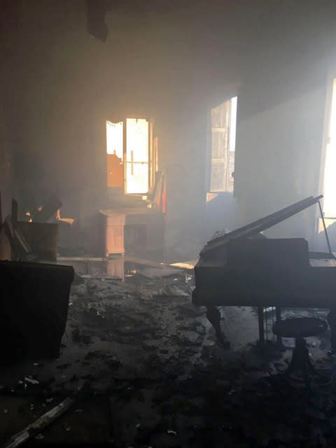 the destroyed interior of a library room in Cosenza, Italy - Credit: Cosenza Library Press Office/ ANSA