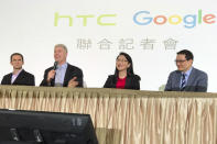 <p>Senior vice president of hardware for Google Rick Osterloh, second from left, speaks during a press conference in New Taipei City, Taiwan, Thursday, Sept. 21, 2017. Google is biting off a big piece of device manufacturer HTC for $1.1 billion to expand its efforts to build phones, speakers and other gadgets equipped with its arsenal of digital services. With Osterloh is, from left, Mario Queiroz, vice president of product management at Google, Cher Wang, chairperson of HTC, and Chia-Lin Chang, president of smartphones and connected devices for HTC. (AP Photo/Johnson Lai) </p>