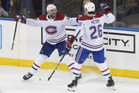 Montreal Canadiens center Nate Thompson (44) celebrates his goal with defenseman Jeff Petry (26) during the third period of an NHL hockey game against the New York Rangers, Friday, Dec. 6, 2019, at Madison Square Garden in New York. The Canadiens won 2-1. (AP Photo/Mary Altaffer)