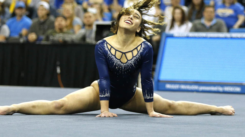 Katelyn Ohashi in action. (Photo by Katharine Lotze/Getty Images)