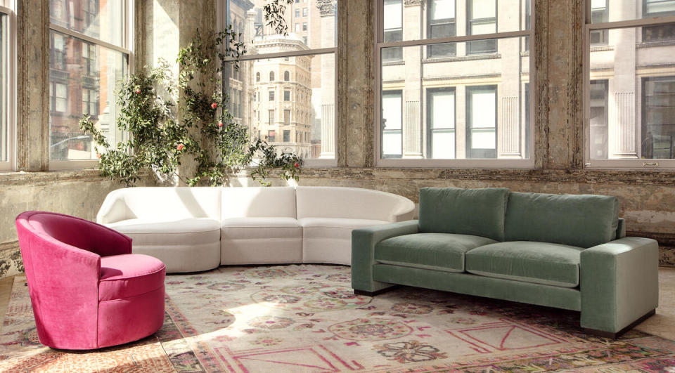 Selections from the Cobble Hill collection by ABC Carpet & Home, including the Elise swivel chair in Watermelon and the Reba Grand sofa in Stone