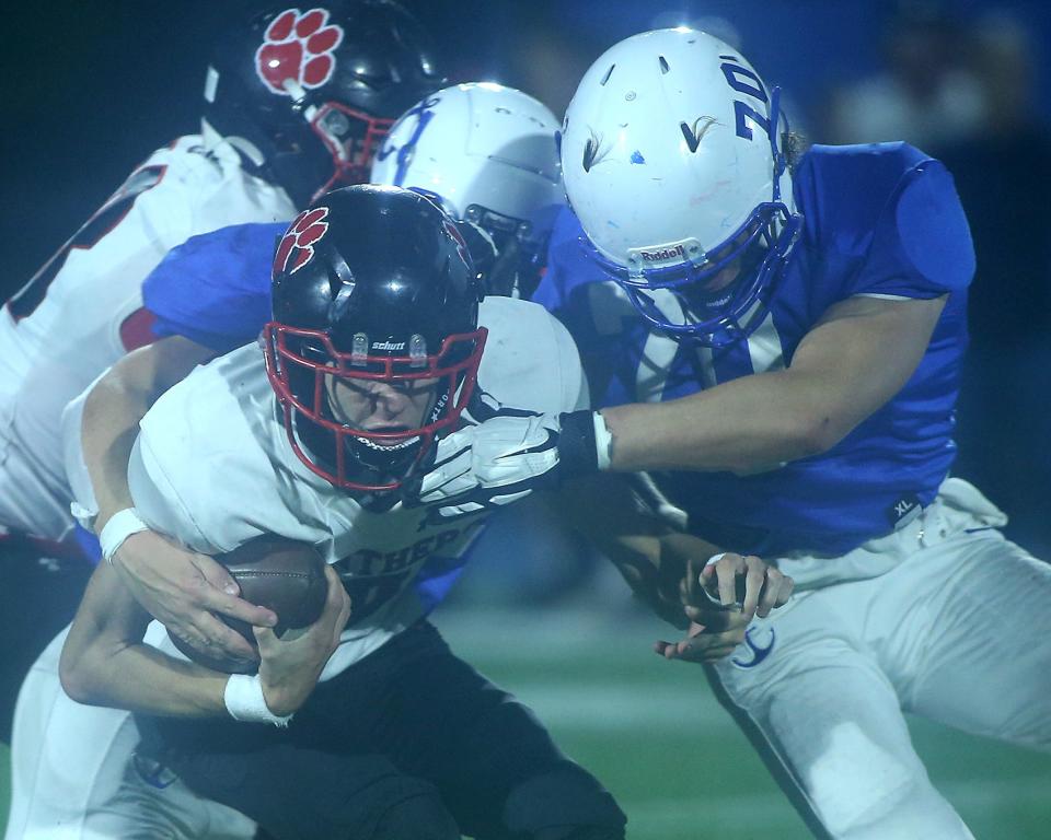 Scituate’s Ronan Manning and Scituate's Charlie Murphy combine on the sack of Whitman-Hanson's Ryan Nash during second quarter action of their game at Scituate High School on Friday, Sept. 15, 2023.