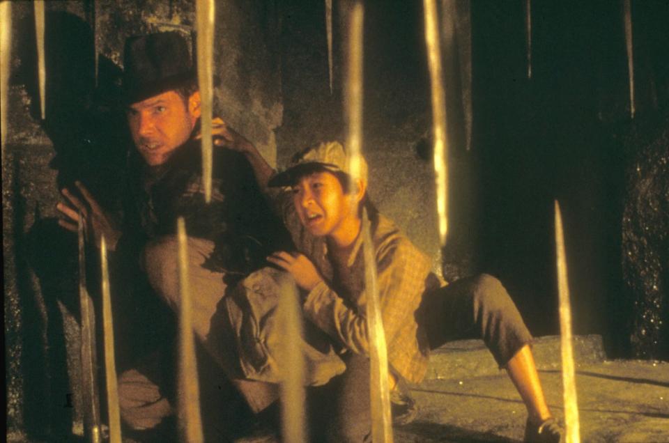 Editorial use only. No book cover usage. Mandatory Credit: Photo by Moviestore/Shutterstock (1592806a) Indiana Jones And The Temple Of Doom, Harrison Ford, Ke Huy Quan Film and Television