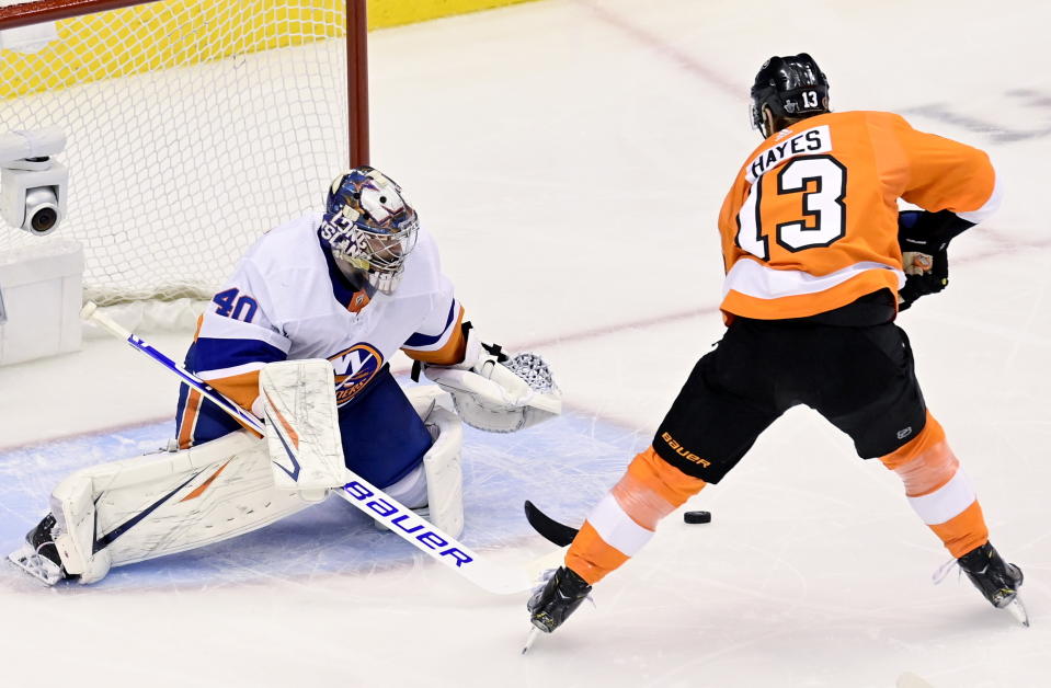 New York Islanders goaltender Semyon Varlamov (40) makes a save against Philadelphia Flyers center Kevin Hayes (13) during first-period NHL Stanley Cup Eastern Conference playoff hockey game action in Toronto, Monday, Aug. 24, 2020. (Frank Gunn/The Canadian Press via AP)