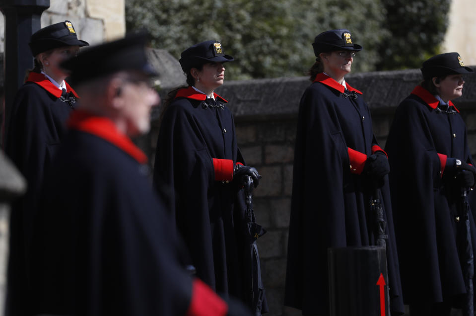 Wardens and armed police guard the Henry VIII gate in Windsor, England, Friday, April 16, 2021. Prince Philip husband of Britain's Queen Elizabeth II died April 9, aged 99, his funeral will take place Saturday at Windsor Castle in St George's Chapel. (AP Photo/Alastair Grant)