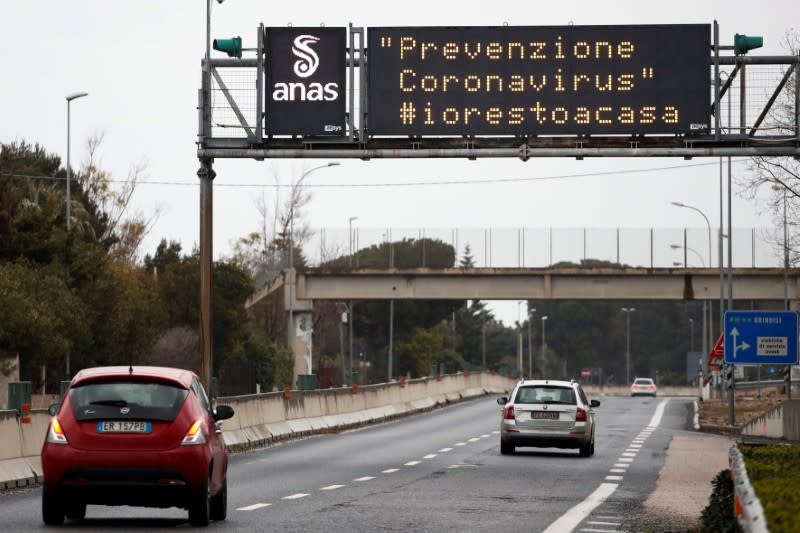 Cars drive past a sign reading "Coronavirus prevention. #istayhome" as the spread of the coronavirus disease (COVID-19) continues, on a freeway near Bari, Italy