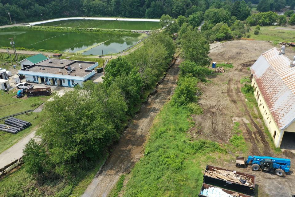 Washout of the Lamoille Valley Rail Trail near the yellow barn in Hardwick.