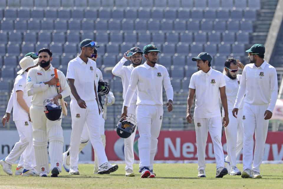 Cricketers leave the field at the end of the first test cricket match at Sylhet, Bangladesh, Saturday, Dec. 2, 2023. (AP Photo/Mosaraf Hossain)