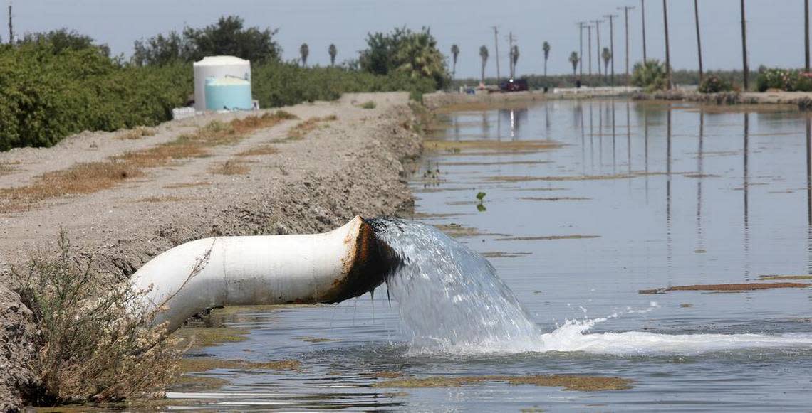 Water gets pumped into a canal near Tranquillity in July. The Valley is suffering from its third year of the drought.