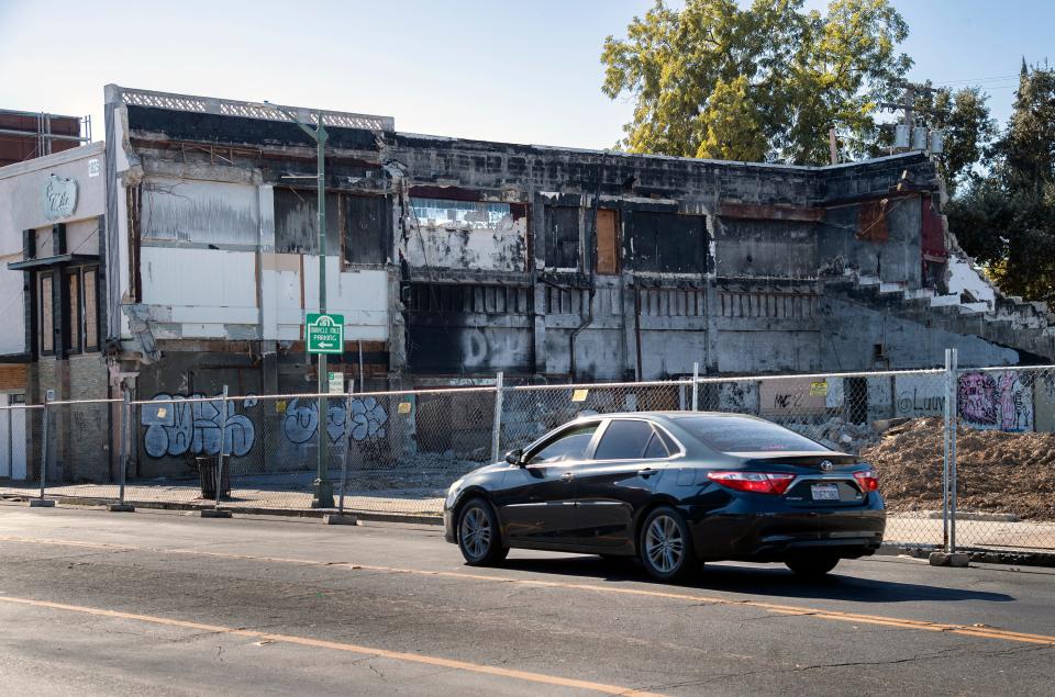The fire-ravaged Empire Theater on the Miracle Mile in Stockton was razed by the pottery owner to make way for a revitalization of the property.