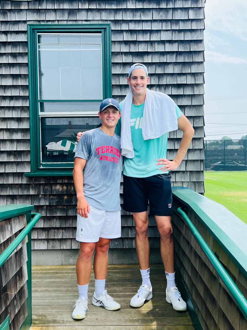 Owen Voigt with John Isner this week at the Infosys Hall of Fame tennis tournament in Newport.