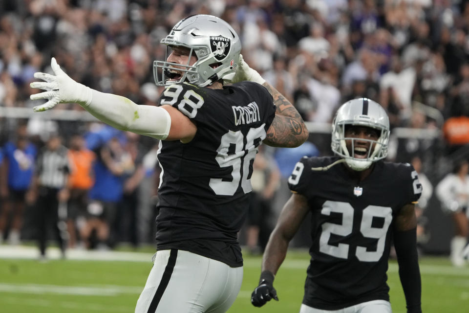 Las Vegas Raiders defensive end Maxx Crosby (98) celebrates after a play against the Baltimore Ravens during the first half of an NFL football game, Monday, Sept. 13, 2021, in Las Vegas. (AP Photo/Rick Scuteri)