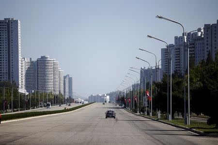 Taxis are driven on an almost empty avenue in central Pyongyang, North Korea October 8, 2015. October 8, 2015. REUTERS/Damir Sagolj