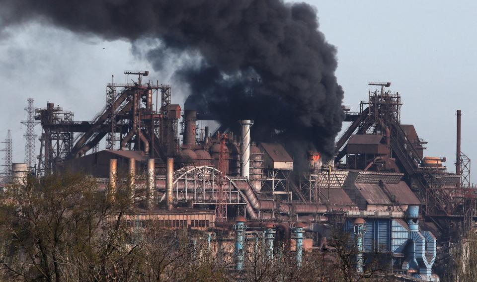 Smoke rises above a plant of Azovstal Iron and Steel Works during Ukraine-Russia conflict in the southern port city of Mariupol, Ukraine 25 April 2022 (Reuters)